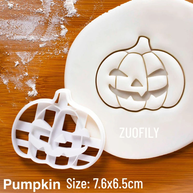 White pumpkin and decorative shapes made from fondant or dough are shown on a wooden surface.