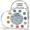 A heart-shaped acrylic sign illustrating the difference between things you cannot control and things you can control for ment