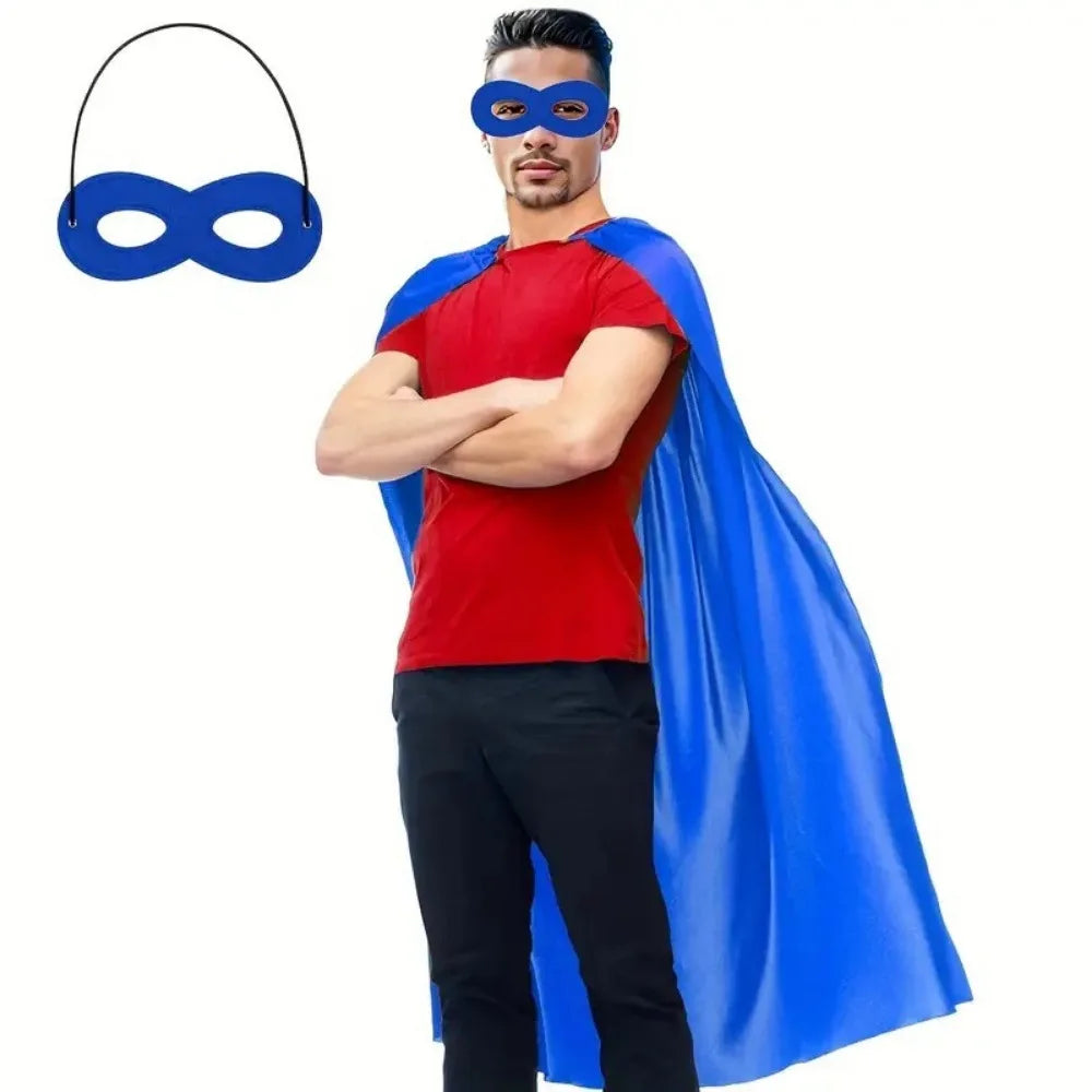A man wearing a red shirt and black pants with a blue eye mask and a flowing blue cape.