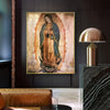 A framed canvas painting of Our Lady of Guadalupe with a golden halo against a muted background.