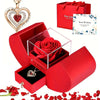 A red gift box containing a rose pendant necklace and a heart-shaped card with a 'Best Wishes' message.