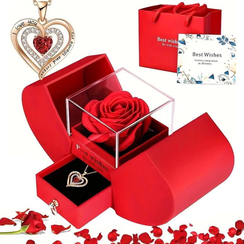 A red gift box containing a rose pendant necklace and a heart-shaped card with a 'Best Wishes' message.