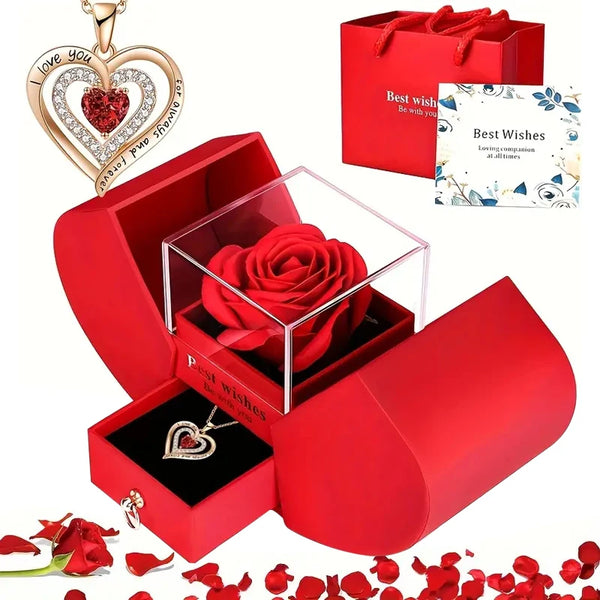A red gift box containing a rose pendant necklace and a heart-shaped card with a 'Best Wishes' message.