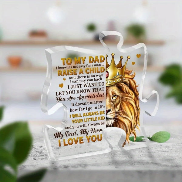 A clear acrylic puzzle keepsake with engraved text 'To my dad I know it's not easy for a man to raise a child and there is no