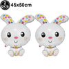 Two white cartoon bunny foil balloons with pink accents and gold crowns
