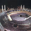 Aerial view of a large crowd gathered in a stadium-like area, likely for a religious event.