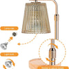 A modern adjustable electric candle warmer lamp with a clear glass shade and brass finish.
