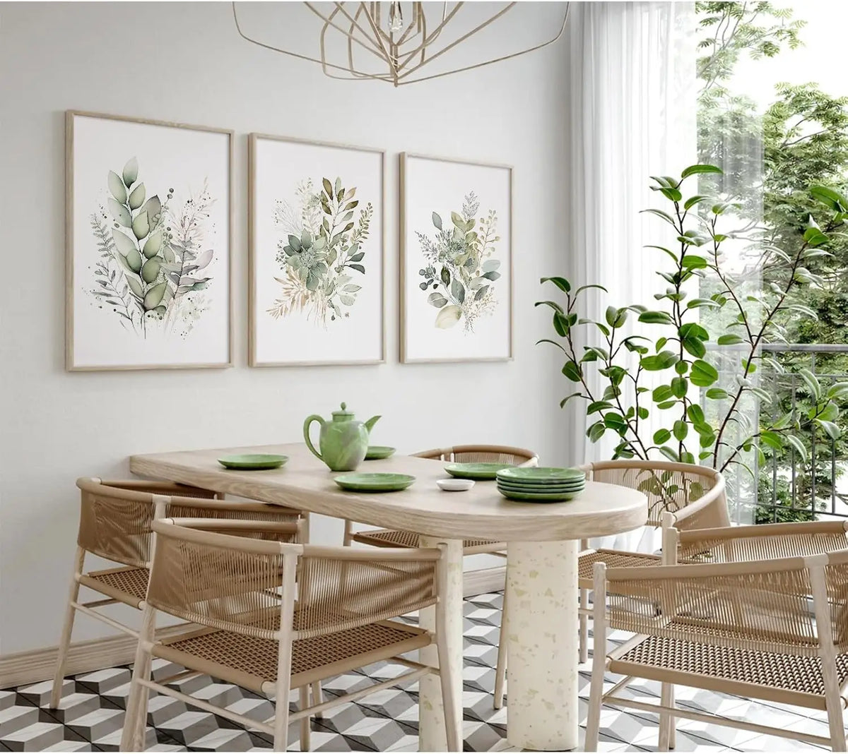Three framed watercolor botanical prints featuring wildflowers and greenery displayed on a wooden table.