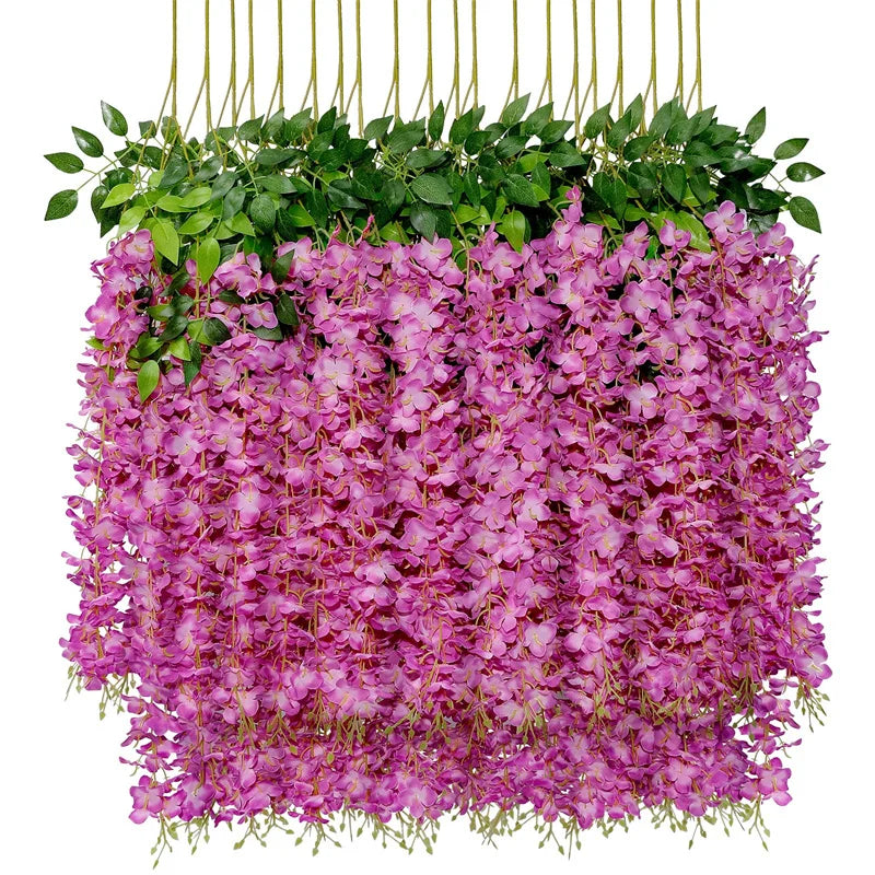 A dense arrangement of artificial purple wisteria flowers and green leaves hanging in a display.