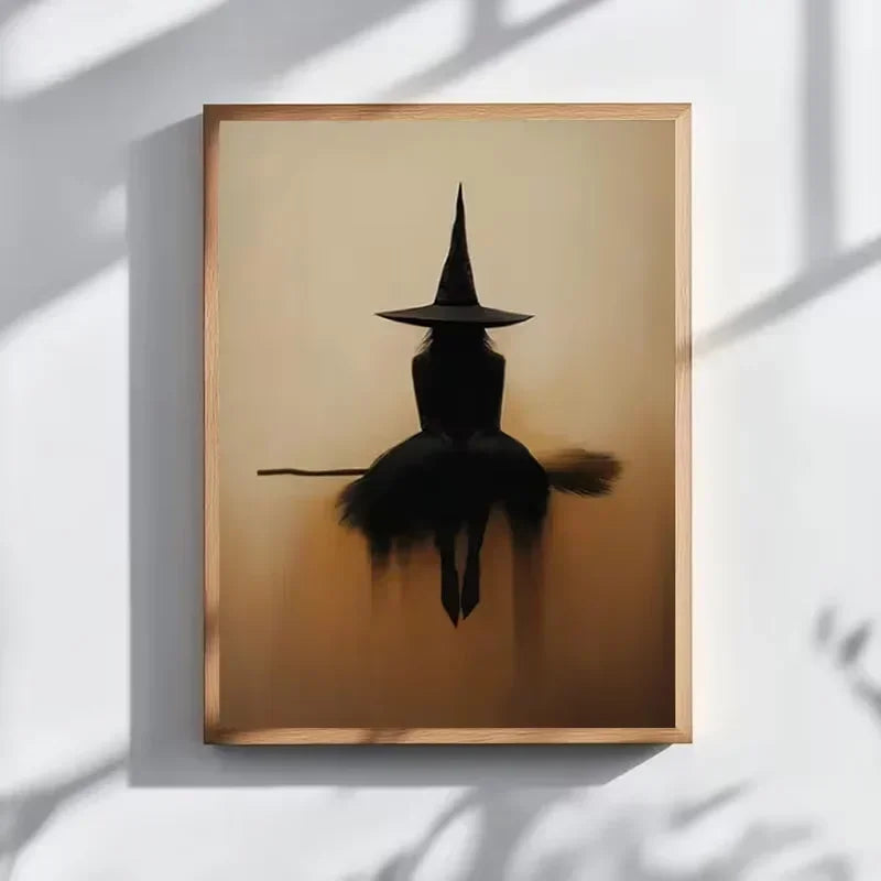 Minimalist witch silhouette wall art featuring a black witch figure on a broomstick against a warm, muted background.
