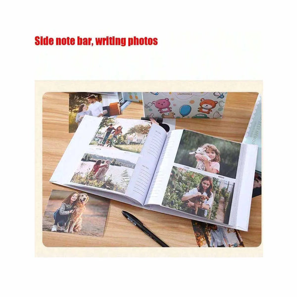 A photo travel album with a side note bar and writing photos is displayed open on a wooden surface.
