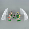 Football birthday cake toppers featuring soccer players and field decor on a gray background.