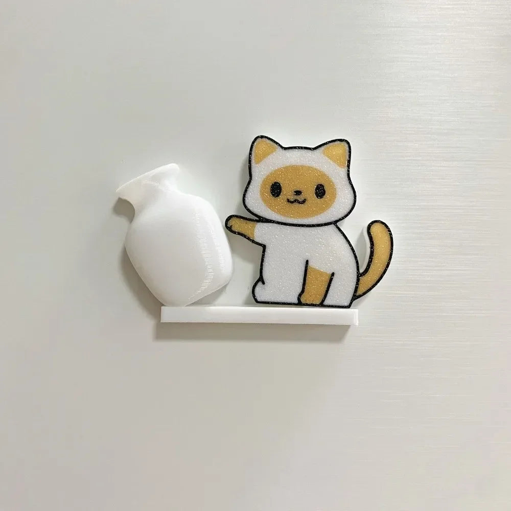 A white acrylic magnetic decor shaped like a cat with orange and white markings.