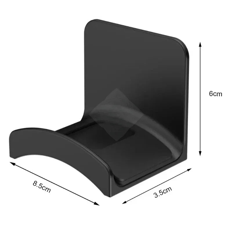 Black adhesive headphone stand designed for desk or wall use.