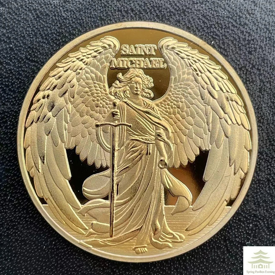 A gold souvenir coin featuring a relief of Saint Michael with wings and a spear.
