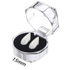 Clear plastic container holding realistic white vampire fangs for costumes