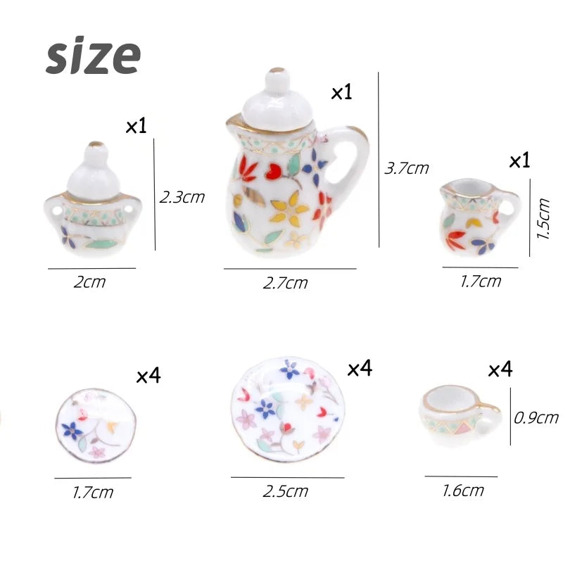 A set of miniature porcelain tea items including a teapot, cup, and saucer for a dollhouse.