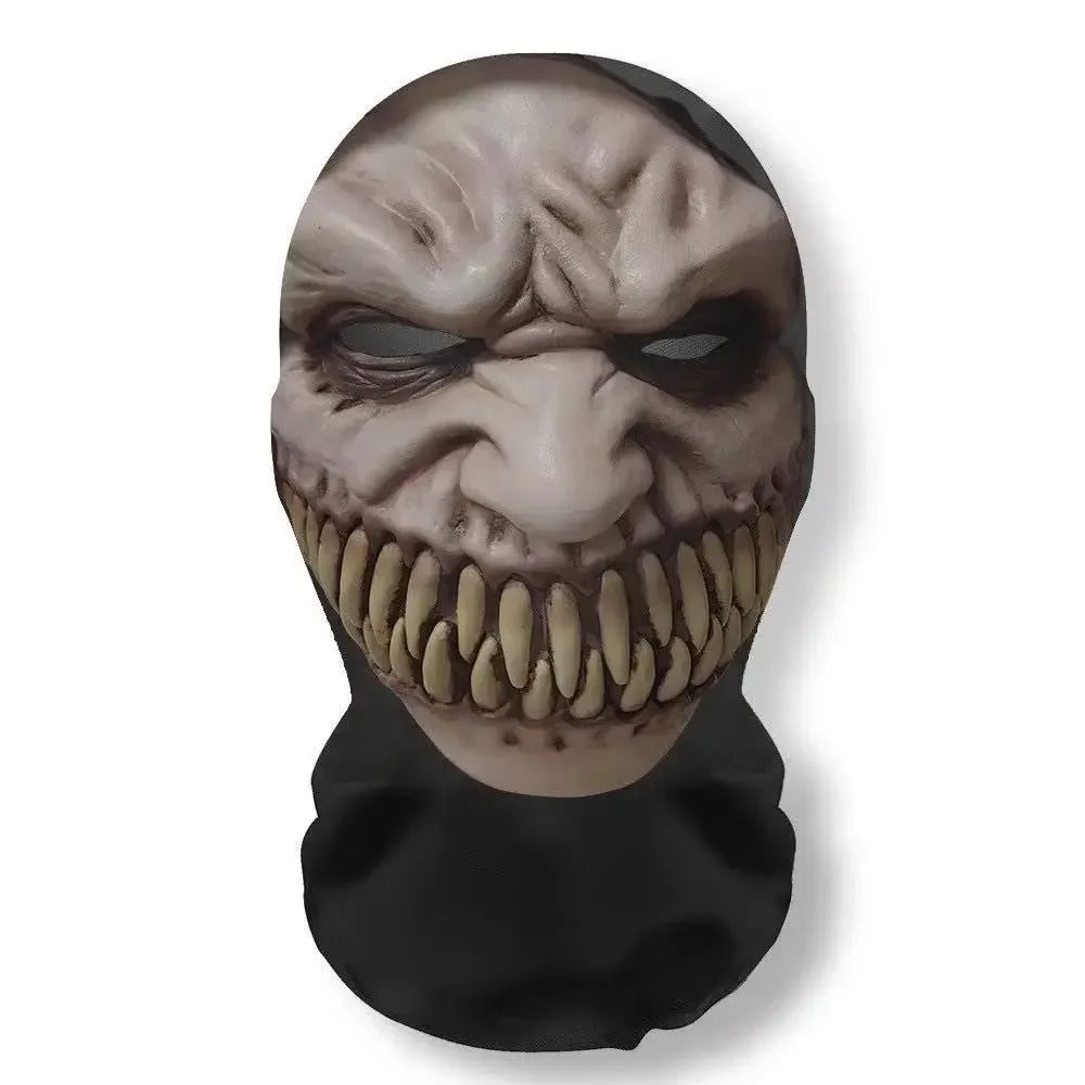 A realistic mask resembling a grotesque, grinning face with sharp teeth and wrinkled skin for cosplay or party use.