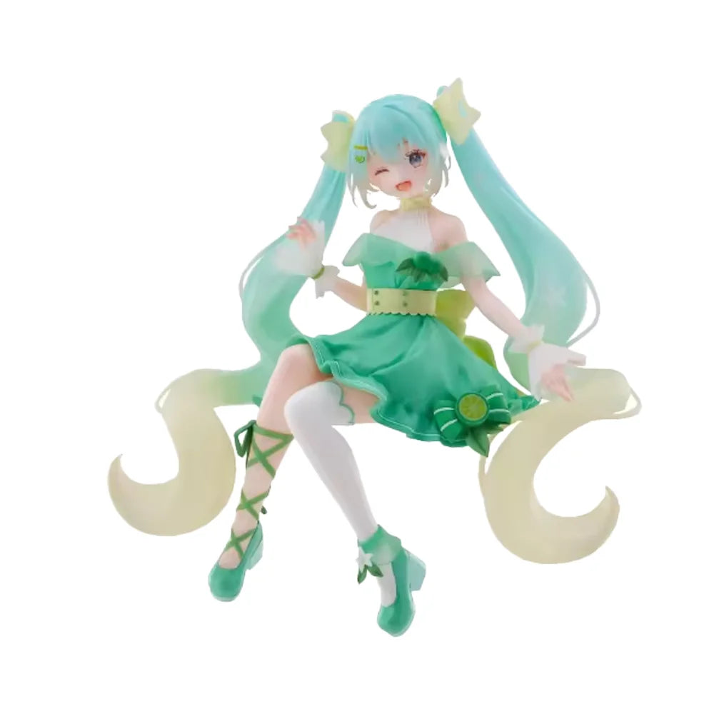 A PVC collectible figurine of Hatsune Miku in a green dress with long light blue hair and white stockings.