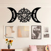 Black metal wall art featuring a pentagram design with crescent moon shapes above and below
