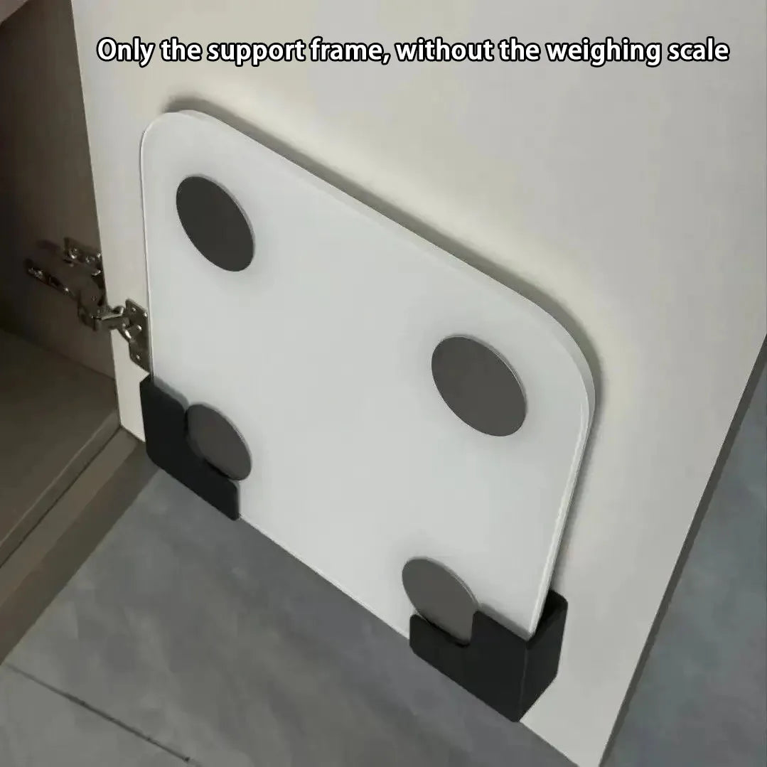 A white support frame for a weighing scale is mounted on a wall, showing the structure without the scale.