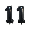 A pair of black foil number balloons shaped like the number 1, intended for birthday party decor.