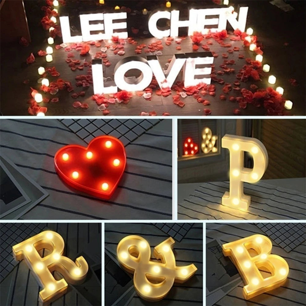 A collection of luminous LED alphabet night lights in various shapes and colors, including a heart, P, R, and B letters.