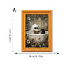 A framed picture featuring a white ghost and a black cat in a decorative frame.