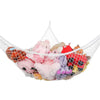 A mesh storage organizer hammock filled with various stuffed animals.
