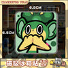 A set of magnetic tiles featuring a green, stylized Pokémon character face.