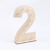 A light wood display stand shaped like the number two, featuring small wooden pegs for holding items.