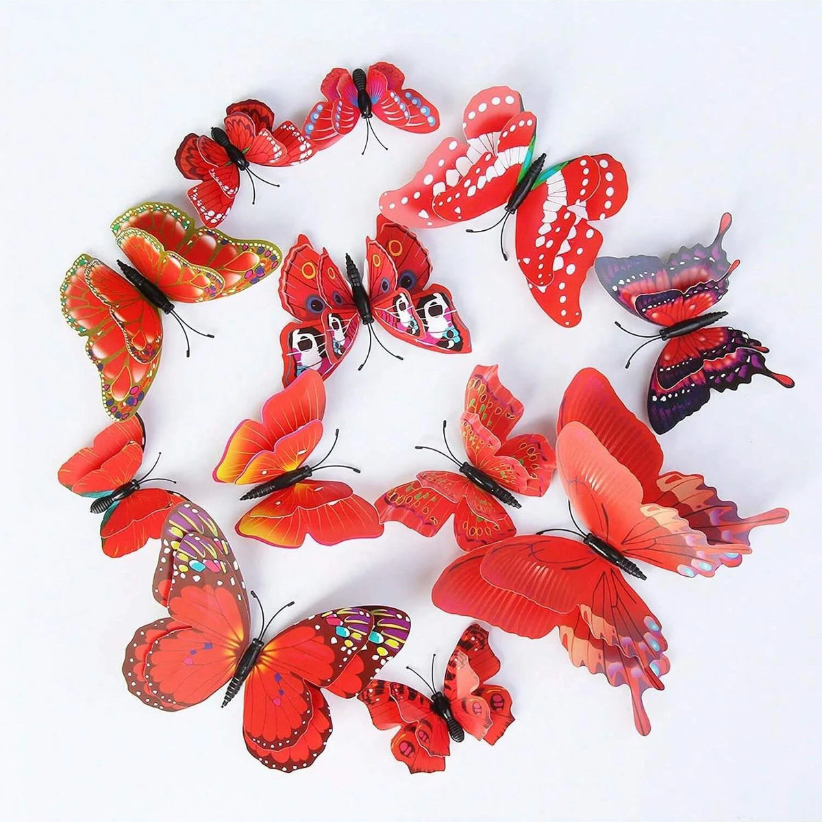 A set of twelve red and orange magnetic butterfly wall decor pieces arranged in a circle.