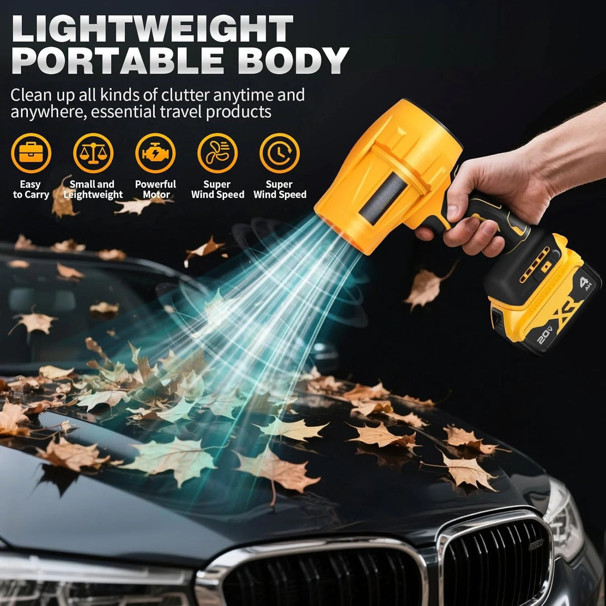 A hand holds a yellow cordless air blower cleaning fallen leaves off a car's hood.