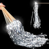 A bundle of silver lighted tinsel wedding wands with LED glow hanging against a black background.