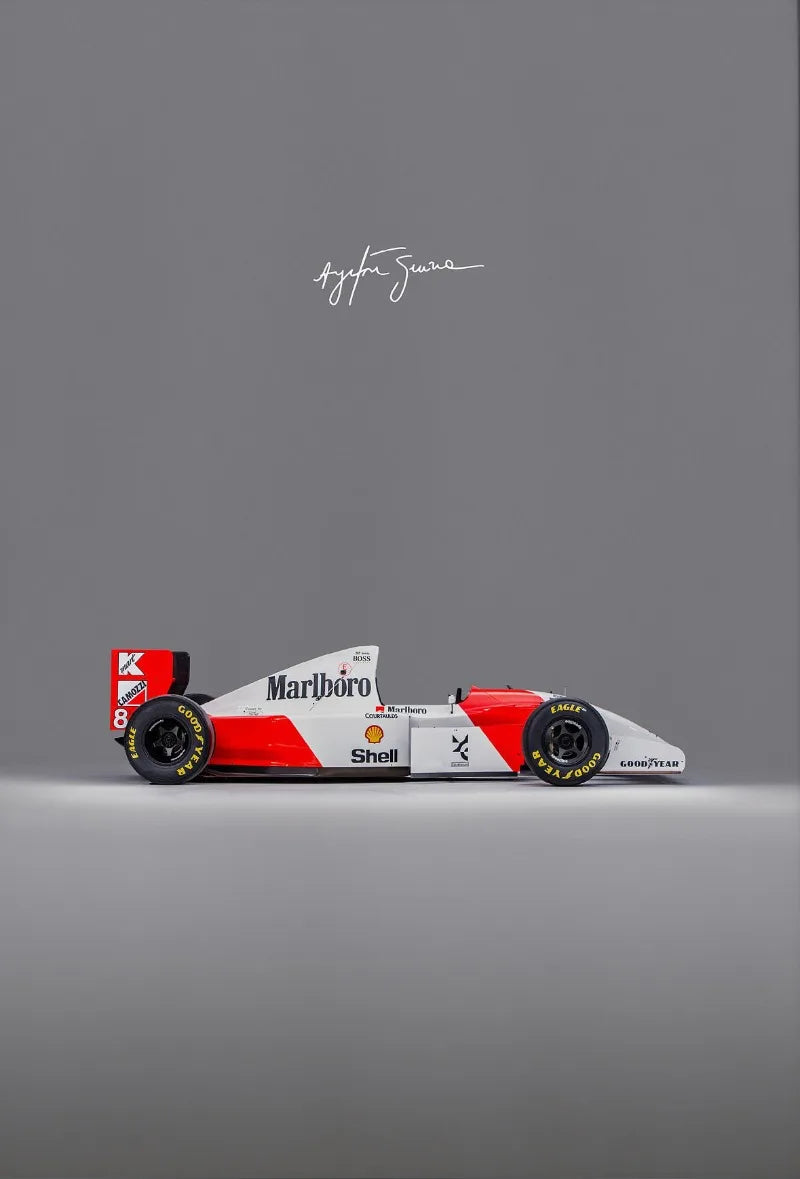 A red and white Marlboro Formula 1 racing car model on a gray background.