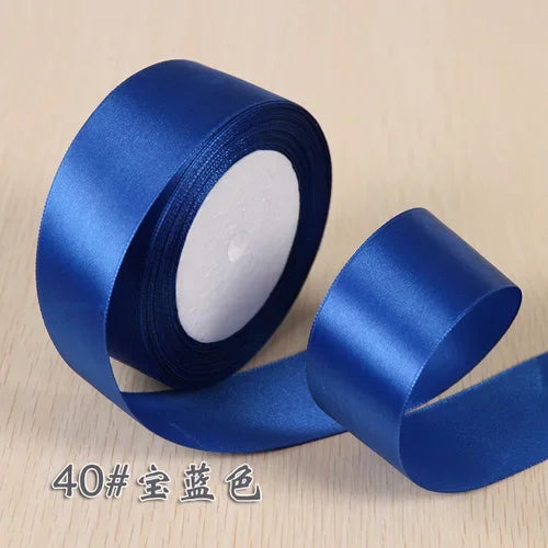 Roll of blue silk satin ribbon for gift wrapping and craft projects