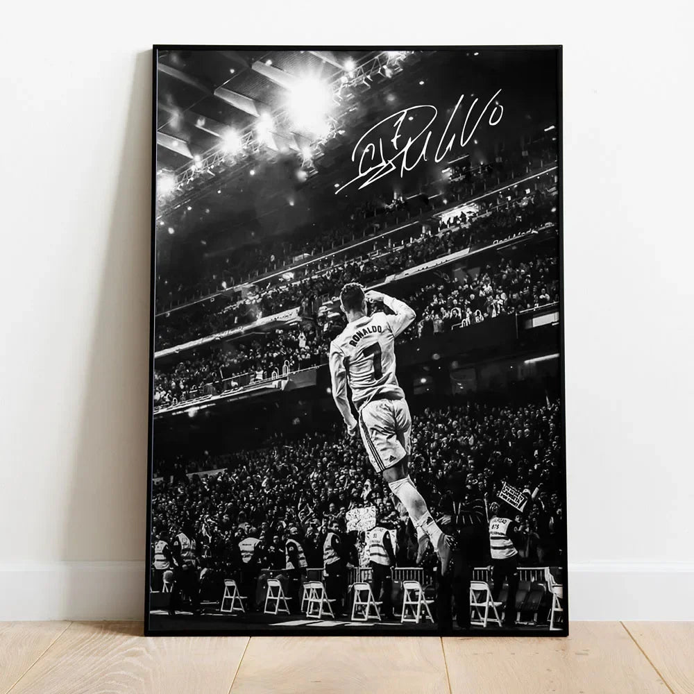 Black and white canvas wall art featuring a silhouette of Cristiano Ronaldo celebrating on a football field with stadium ligh