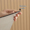 A hand holds a thin, textured wall panel showing a thickness of 3mm.