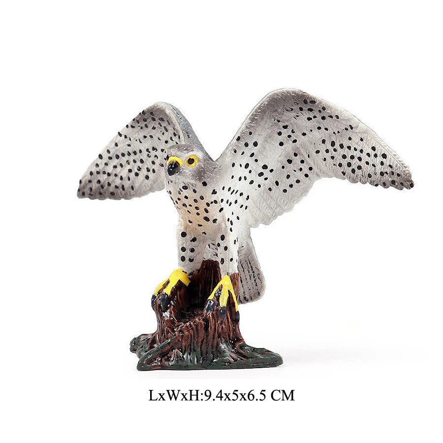 Realistic figurine of an owl with yellow eyes perched on a dark base.
