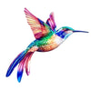 Vibrant iridescent hummingbird wall art featuring brilliant pink, green, and blue feathers.