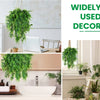 A display of various artificial ivy vine garlands and potted plants used for indoor and outdoor decoration.