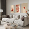 A modern living room features a light sofa, wooden coffee table, and framed retro letter art canvases on the wall.