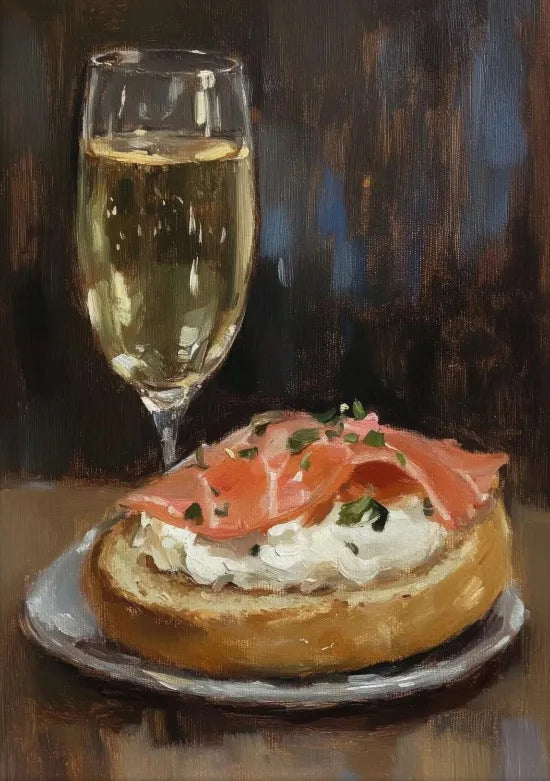 A glass of white wine next to a plate of smoked salmon and cream on toast.