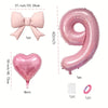 Pink foil balloons shaped like a bow, heart, and number 9 for party decoration
