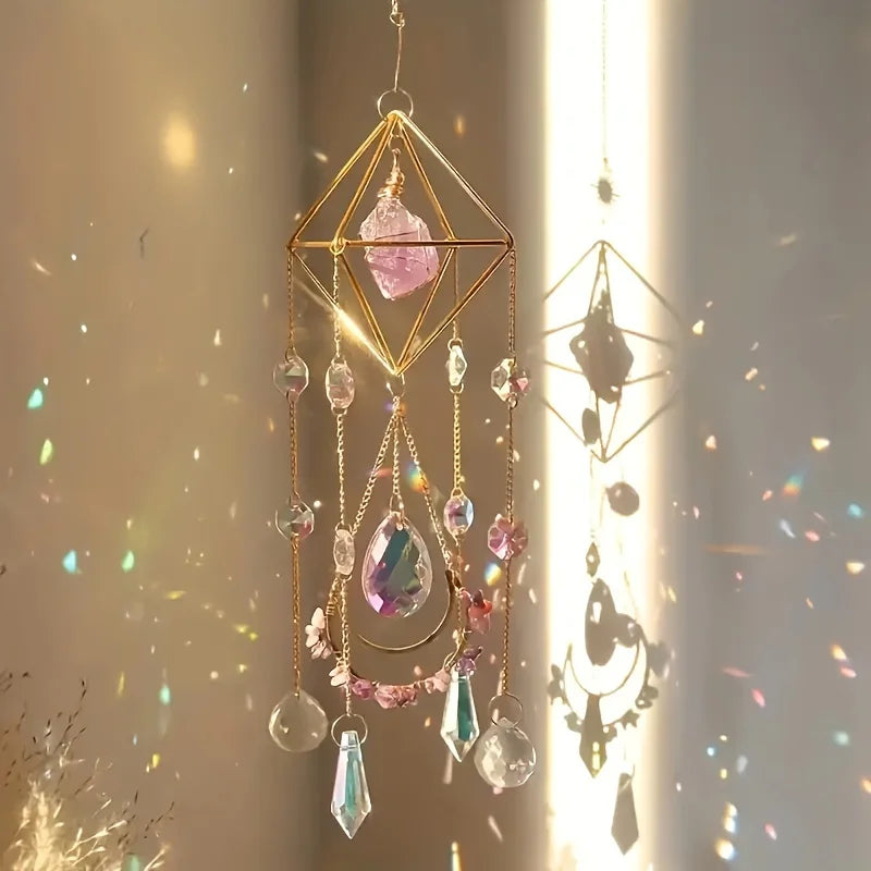 A hanging amethyst crystal suncatcher with golden plated accents and various colored glass beads.