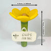 A yellow flower with a green stem and a tag labeled Cups for Bee is shown.