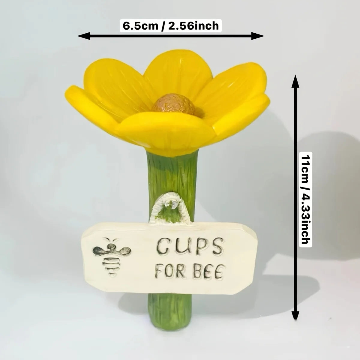 A yellow flower with a green stem and a tag labeled Cups for Bee is shown.