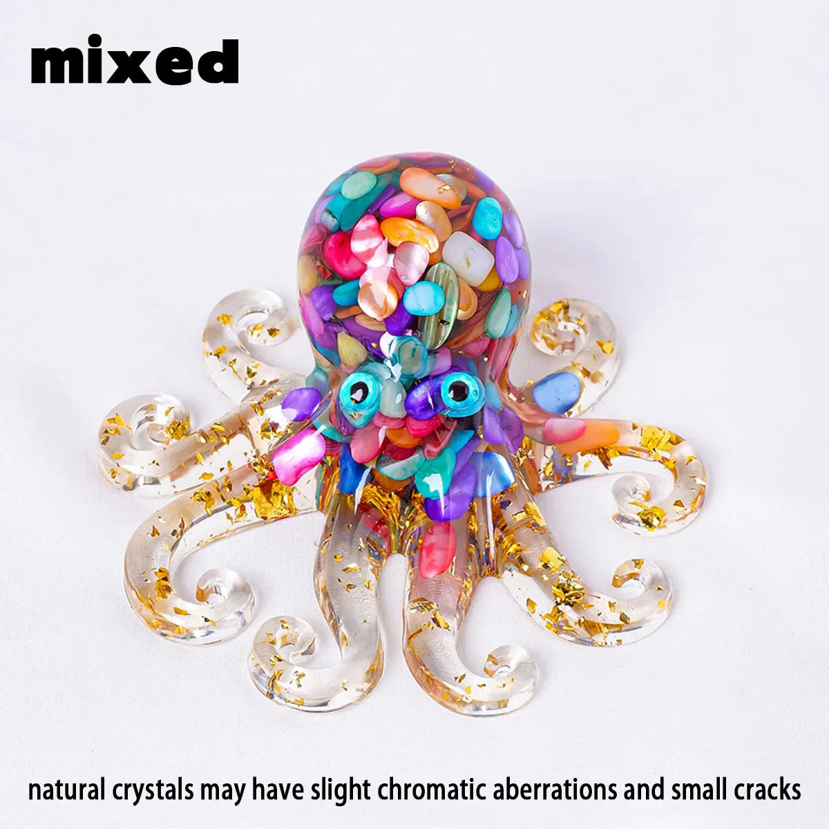 A clear crystal octopus statue with colorful inclusions and gold accents.