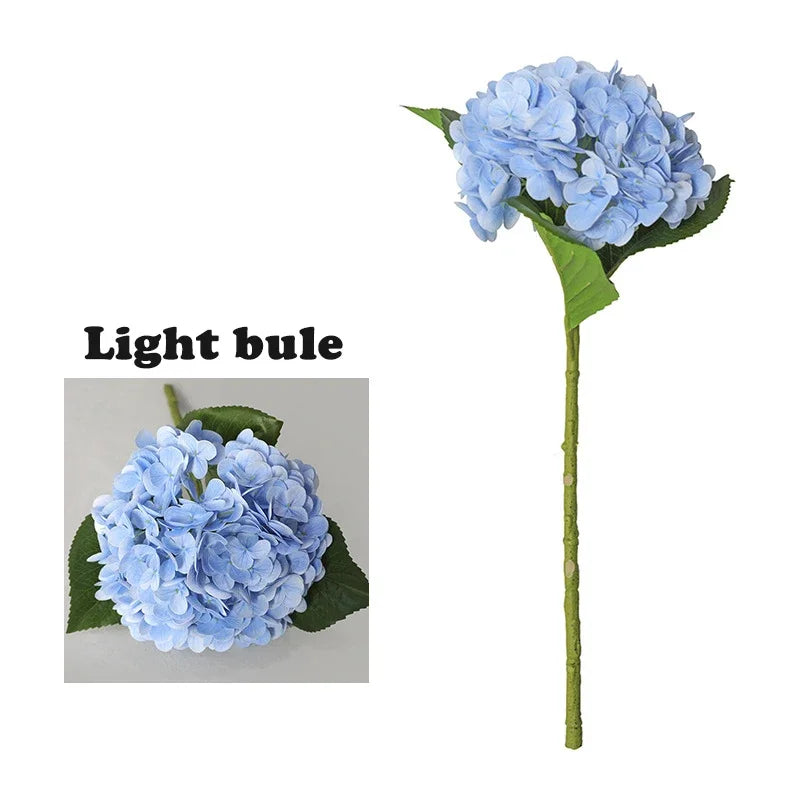 A light blue latex hydrangea flower on a green stem.