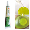 A bottle of clear adhesive for squishy toys repairs with a dropper, showing the liquid and a green squishy toy.
